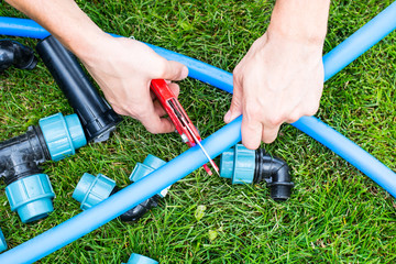 Technician adjusting sprinkler head