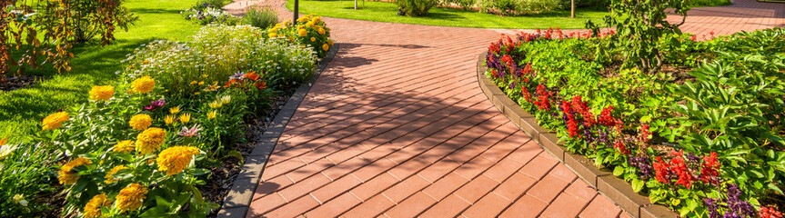 Finished landscape with fresh sod and flower beds