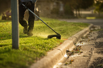 Team mowing residential lawn